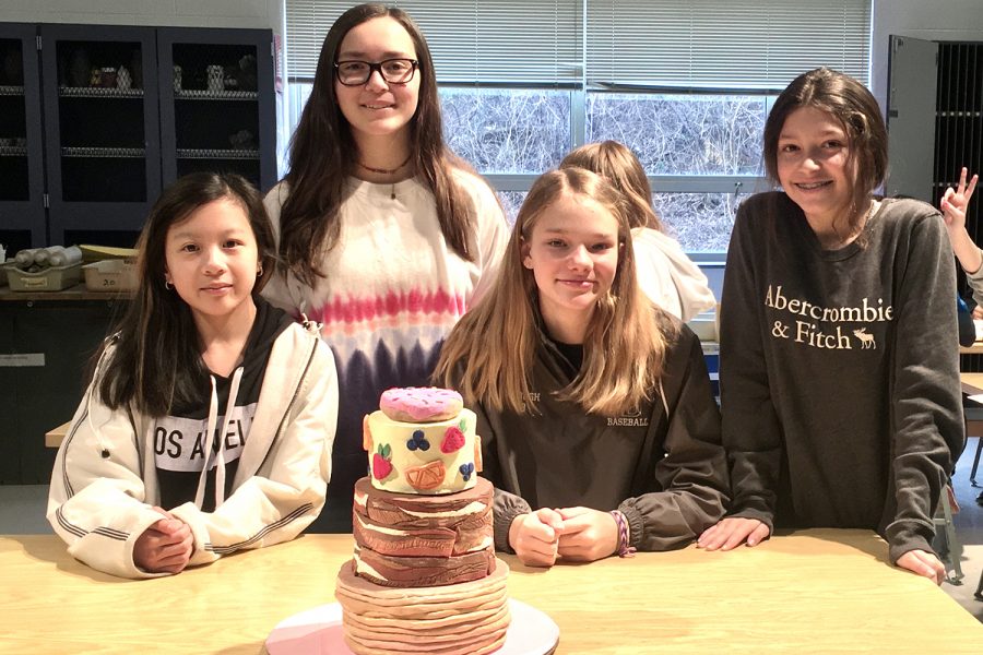 Fiona K. (7), Kayla C.(8), Ana C. (8), and Audrey H. (8) created a breakfast cake for their class clay bake-off. They won 1st place for their period. It has layers of pancakes, bacon and fruit. 