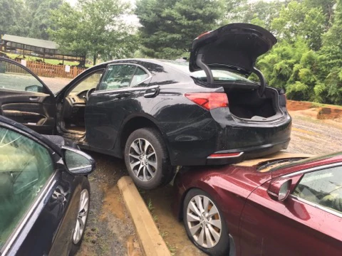 Cars were lifted in the flood waters last year in the parking lot of McLean Little League.