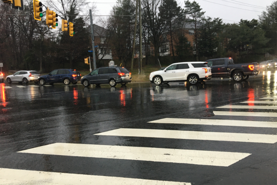 Cars cross the intersection of Westmoreland and Kirby, moving towards Longfellow during the morning back-up for Kiss and Ride.
