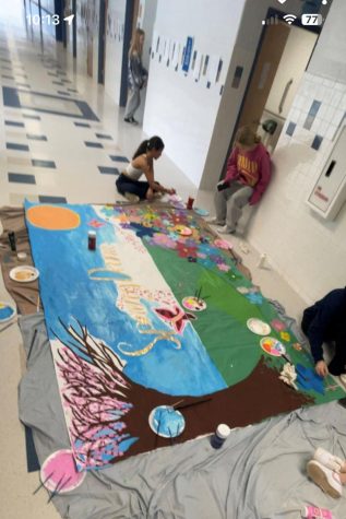 Hallways cameras captured the hard work of  NJHS students painting the mural for the Spring Dance, which was hosted by NJHS